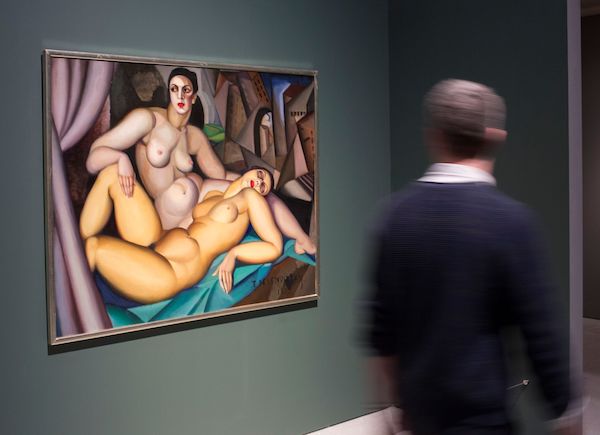 Modern Couples: Art, Intimacy and the Avant-garde Installation view featuring Tamara de Lempicka, Les deux amies, 1923 Barbican Art Gallery