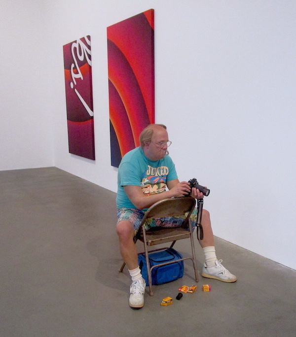 American Duane Hanson’s life-size sculpture of a Man with Camera (1991-1992)
