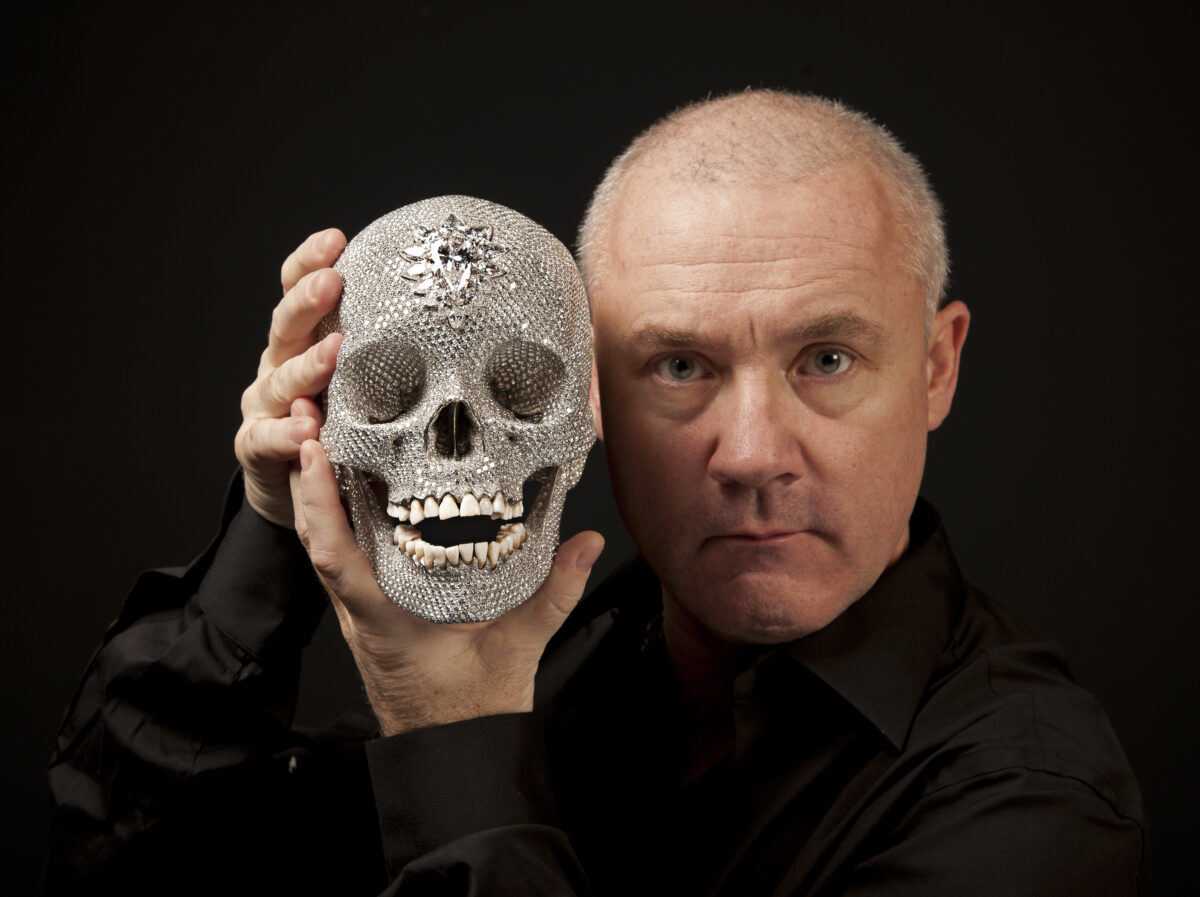 Damien Hirst with For the Love of God, 2012 Photographed by Prudence Cuming Associates L td. © Damien Hirst and Science Ltd. All rights reserved, DACS/Artimage 2023 – Damien Hirst’s Diamond Skull